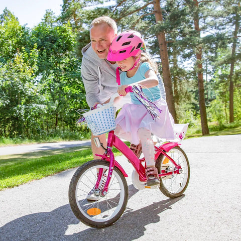 Child on pink bike with adult in park using Go To 16 Inch Bike Inner Tubes Pack, 16x1.75 to 2.125 Range, 2 Durable AV32mm Schrader Valve Tubes
