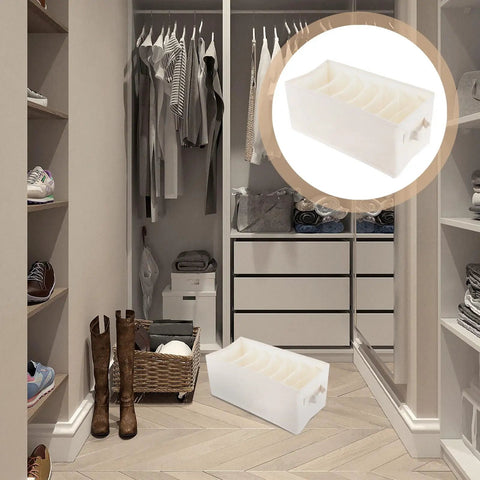 Beige Linen Cotton Seven Grid Folding Clothes Organizer Box Durable Closet Storage Bin For Tidy Wardrobe Vibes in a stylish closet.