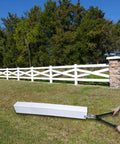 Person using Vinyl Fence Notcher For Rails, Heavy Duty Rail Notcher With Three Quarter Inch Notch on a white vinyl fence.
