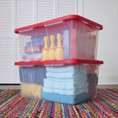 Kickass Clear Plastic Storage Bins Pair 27 Gallon Stackable Totes With Red Snap On Lids And Built In Handles filled with towels and decor