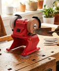 Hassle Free Cordless Mini Bench Grinder Spinning At 5500 Rpm For Lightning Fast Metal Polishing Deburring And Edge Beveling A No Strings Attached Portable Tool in use on a wooden table.