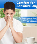 Man holding tissue, eyes closed, seeking comfort in a cozy home setting, promoting serene indoor air quality solutions.