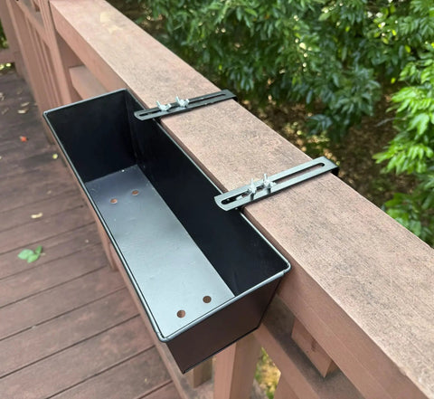 Set Of Four Heavy Duty Metal Railing Planters, 16 Inch Rectangular Window Boxes with brackets mounted on a wooden deck rail.