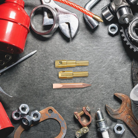Spot Welder Chuck For Dent Removal Kit showing metal weld rod and pad surrounded by auto repair tools