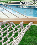 Close-up of the Double Rope Hammock With Stand Included, 12ft Heavy Duty Stand, showcasing hardwood spreader bar with cotton rope.