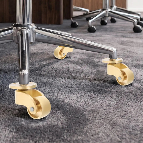 Solid Brass Roller Wheels With Vintage Swivel Casters And Anti Scratch Pads For Heavy Duty Furniture Glides on a chair.