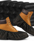 200 Pack Disposable Shoe Covers Non Slip Waterproof Non Woven Fabric Black Booties over brown boots, arranged in stacks