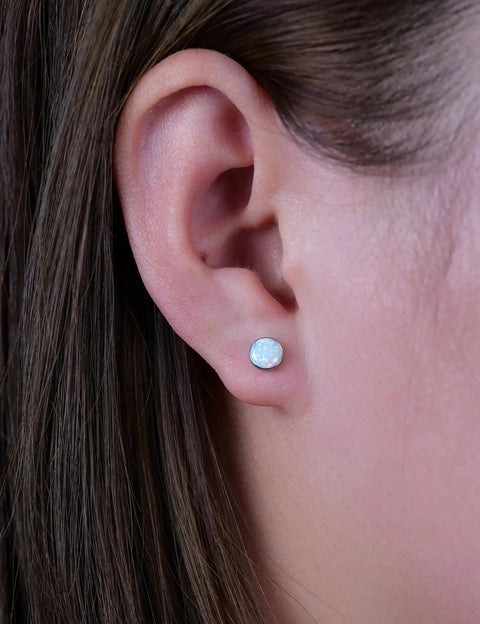Solid Implant Grade Titanium Screw Back Earrings Made For Sensitive Skin With Hypoallergenic F136 Studs That Stay Put And Keep Your Jewelry Low Drama Always, worn in ear with white opal stone.