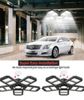 Super Bright 300w Deformable Led Garage Lights With Five Adjustable Panels in a large garage illuminating a parked car