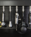 Locking Air Tool Holders Five Pack For One Quarter Inch Pneumatic Tools mounted on black metal, chrome finish visible