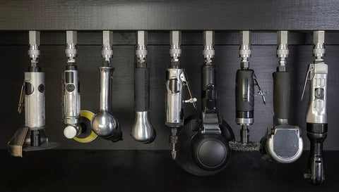 Locking Air Tool Holders Five Pack For One Quarter Inch Pneumatic Tools mounted on black metal, chrome finish visible