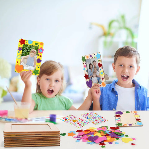 Children holding decorated frames from 24 Pack Picture Frame Craft Kit For 4x6 Photos Unfinished Wooden Frames With Diamond And Foam Stickers DIY Paint And Decor Supplies Includes 150 Rainbow Glitter Foam Stickers In Heart And Star Shapes And 2 Sheets Rhinestones in a creative setting.
