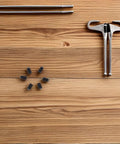 Big Time Stainless Steel Ball Plunger Set M4X6MM Spring Loaded Positioning Screws on wooden surface with tools.