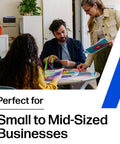 Three people discussing documents in a small office setting, ideal for small to mid-sized business teamwork.