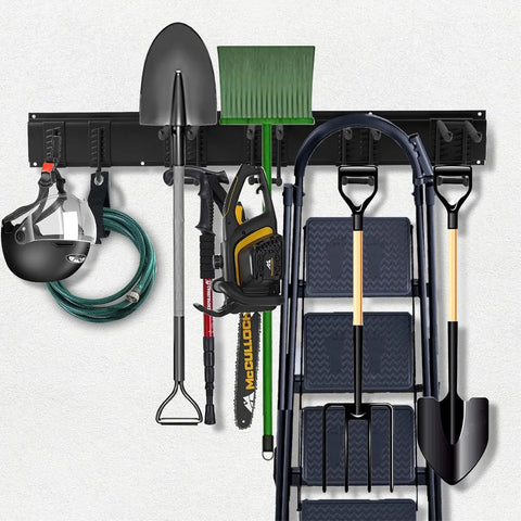 96 Inch Heavy Duty Wall Mounted Tool Organizer With Assorted Hooks And Slot Boards For Garage Storage Rack holding shovels, helmet, and tools.