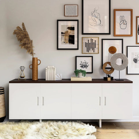 Modern living room with white cabinet showcasing framed art and decorative items on a dark countertop.