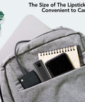 Gray backpack with laptop, notebook, smartphone, and compact devices in front pocket, showcasing portable convenience.