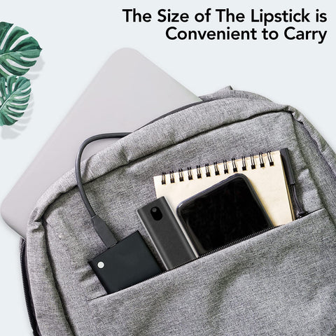 Gray backpack with laptop, notebook, smartphone, and compact devices in front pocket, showcasing portable convenience.