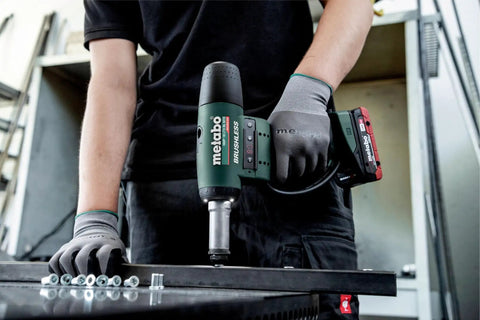 Top Shelf 18V Cordless Rivet Nut Gun With Hella Precision Adjustable Settings in use on metal surface with fasteners.