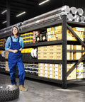 Heavy Duty Metal Garage Shelving Unit With Fully Adjustable Shelves Built Tough As Nails For Serious Home Garage Organization And Crushing Up To Five Thousand Pounds Of Tools Without Breaking A Sweat Or Budging An Inch in a spacious garage setting with tools and boxes.