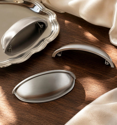 Top Shelf Brushed Nickel Cup Pulls 3 Inch Center To Center For Kitchen Cabinets And Bathroom Vanities Three Pack on a wood surface.