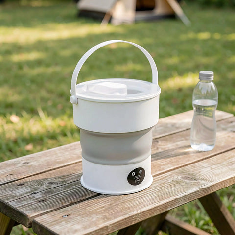 Sweet Compact Folding Mini Washing Machine Portable Travel Washer For Socks Underwear And Delicates Quick Rinse Auto Drain Straight Up Compact Design For Dorms on a wooden table outdoors.