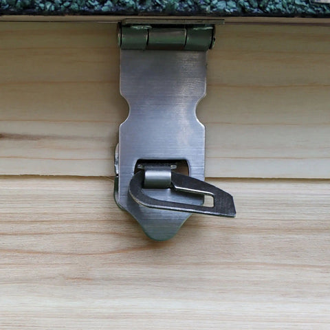 Close-up of hinged locking mechanism on No Sweat Wooden Chicken Coop With Hinged Nesting Box And Removable Egg Tray featuring sturdy metal.