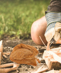 Natural Jute Fire Starters Four Pack Lightweight And Easy To Carry Outdoor Fire Starter Tools For Camping Backpacking Survival Gear Emergency Prep Must Have Go To All Weather Fire Starters For Camping And Backpacking In Any Conditions next to kindling and gloved hand