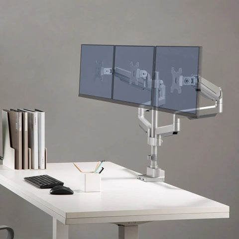 Clean Workspace Upgrade Featuring Versatile Triple Monitor Pole Stand With Rock Solid Build And Smooth Glide Swivel Tilt Control Plus Integrated Usb Charging Ports For Effortless Grommet Installation Gray with three adjustable monitors.