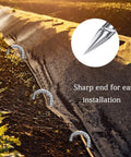 Heavy Duty 12 Inch Galvanized J Hook Ground Anchors Set securing landscape fabric in garden with close-up of sharp end