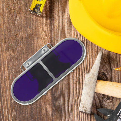 Industrial Grade Welding Goggles Featuring Adjustable Screw Clip Clamp Design To Keep Your Peepers Protected During Heavy Steelworking Grind Tough As Nails Professional Eye Shielding For Dedicated Builders And Trades Pros on a wood surface with tools.