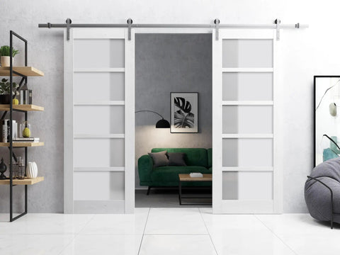 Sliding Double Barn Doors Featuring Frosted Glass And Nordic White Finish 42 By 96 Inches with stainless steel hardware in modern living room.