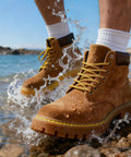 Waterproof Shoe Protector Spray With Nano Protection For Rain And Stain on brown boots resisting water splash outdoors.