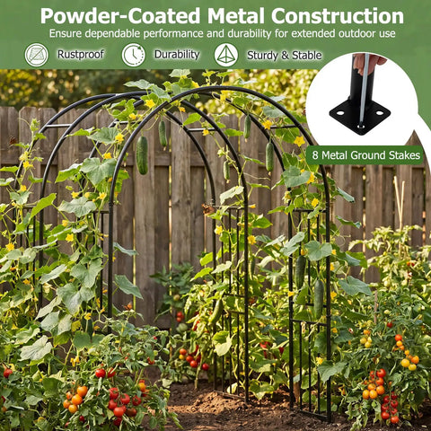 7.2 Ft Outdoor Steel Garden Arch Arbor With Stakes, supporting climbing plants, wide black metal archway in a garden.