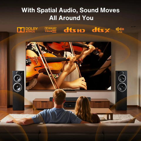 Couple enjoying a home theater setup with Extra Long 10 Foot Toslink Optical Audio Cable With Rock Solid SPDIF Digital Output.