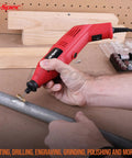 Person using Rock Solid 130W Corded Rotary Multi Tool Kit for cutting metal pipe with precision, red tool in action.
