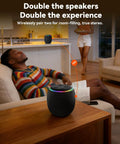 Room 3 Portable Bluetooth Speaker With IPX6 Waterproof Build TWS Pairing 12W Bass Boomin Stereo Sound With RGB Lights in a living room.