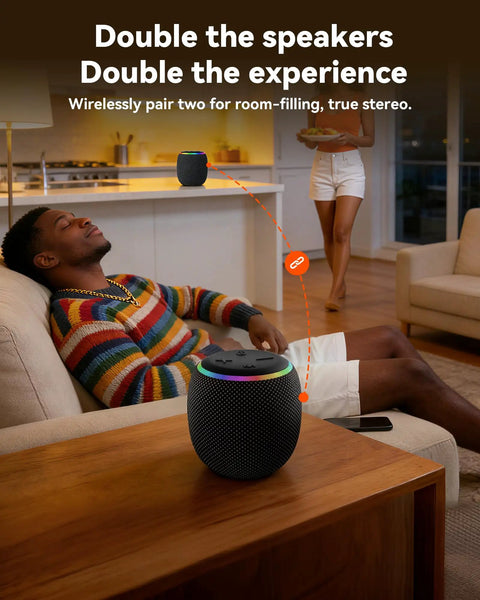Room 3 Portable Bluetooth Speaker With IPX6 Waterproof Build TWS Pairing 12W Bass Boomin Stereo Sound With RGB Lights in a living room.