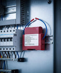 Hot Aerosol Fire Extinguishing Device mounted in a control panel, designed for automatic fire suppression.