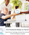 Volunteer handing Travel Laundry Kit to man at a community event outdoors.