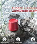 Compact Waterproof Bluetooth Speaker With Big Sound, Portable Mini Wireless Speaker on rocky outdoor setting, red color