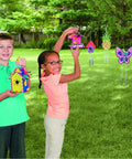 Kids enjoying Paint Your Own Wood Wind Chimes Craft Kit With Twelve Unfinished Wind Chimes Featuring Circle Heart And Star Designs For Kids Aged Four To Eight A DIY Arts And Crafts Activity For Parties And Creative Projects outdoors, showing decorated chimes.