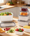 Five Pack Fridge Storage Containers With Removable Colanders, Leakproof Lids, And Clear Lids in kitchen with fruits and vegetables