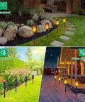 Solar Flame Torch Lights For Outdoor Decoration 12 Pack in yard, illuminating with waterproof LED flickering flames.