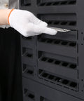 Outdoor Garden Composter Bin With 132 Gallons Capacity, Made From Recycled Plastic, shown being assembled with a cutting tool.