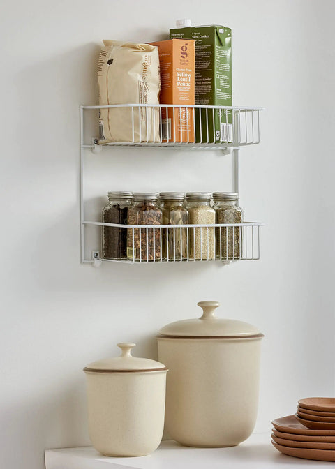 Slick Two Tier Wall Rack For Cabinet Doors And Walls, Heavy Duty Epoxy Coated Steel Storage Shelf In Crisp White with kitchen supplies.