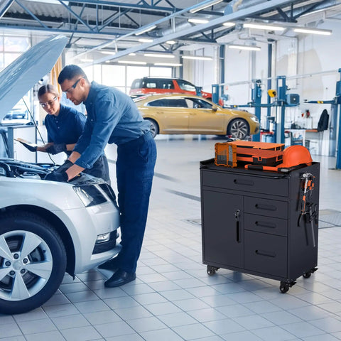 Beast Mode 30 Inch Tool Storage Cabinet With Lockable Drawers And Smooth Rolling Casters Ultimate Garage Locker in black beside mechanics working on a car.