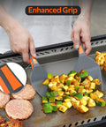 Hands using Four Piece Non Stick Griddle Kit For Blackstone Griddles Includes Large Spatula Long Spatula Griddle Scoop And Tong Tailgate Ready Barbecue Gear For Backyard Hibachi And Camp Chef Compatible to cook vegetables and burgers on a griddle.