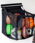 Heavy Duty Basketball Wall Mount Rock Solid Sports Ball Rack, 20x18x22 black mesh, storing multiple sports balls and drinks.