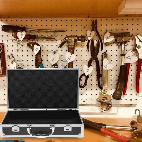 Kickass Aluminum Toolbox Carrying Case With Grip Handle on a workbench with hanging tools in the background.